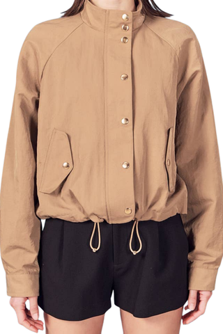 English Factory Lightweight Bomber Jacket in beige with long sleeves, front pockets, and an adjustable drawstring hem.