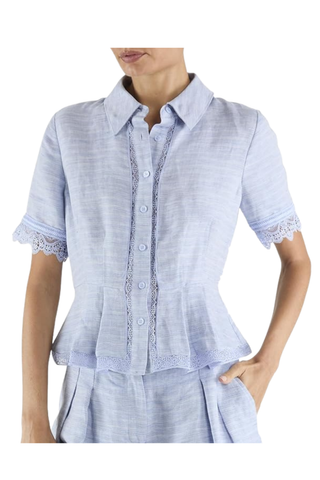 Ramy Brook Becky embroidered short sleeve linen top in Bazaar Blue featuring lace trim, button-front closure, peplum hem, and tailored silhouette