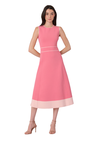 Woman wearing a pink dress on a white background