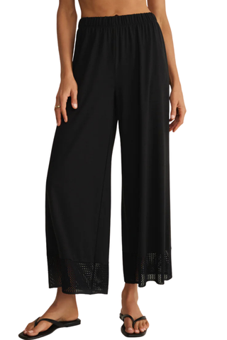 Z Supply Banyan Crochet Pant in Black featuring a relaxed straight-leg silhouette, elastic waistband, and crochet lace trim at the hem