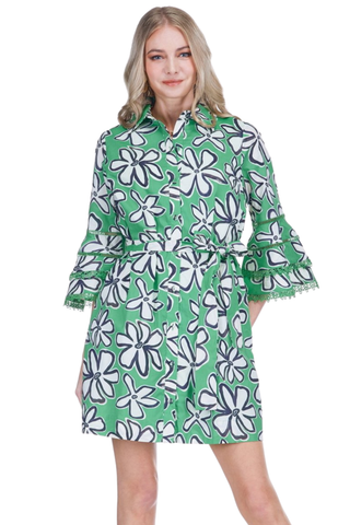 Woman wearing a green floral dress on a white background