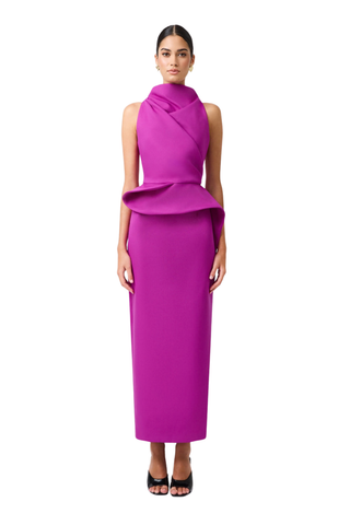 Elliatt Lioris Gown in Orchid featuring a rich purple hue, high neckline, asymmetric draped peplum, and floor-length silhouette.