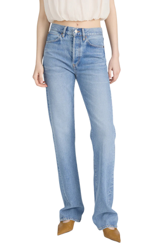 Model wearing FRAME The Vertical Jean in Static, a high-rise straight-leg rigid denim jean in a light vintage wash