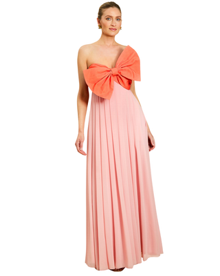 Mestiza Kiss Me Knot Gown in Bloom Pink featuring a strapless chiffon silhouette with an oversized statement bow and flowing skirt.