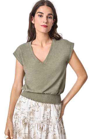 Model wearing the Lilla P Smocked Hem V-Neck Tee in Fern featuring a relaxed blouson fit, V-neckline, extended shoulders, and smocked elastic hem.