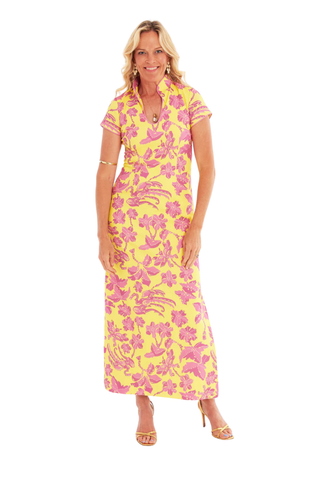 C.K. Bradley Tarpon maxi dress in Lingren Sunset print featuring pink floral motifs on a yellow background, short sleeves, mandarin collar, and side slits
