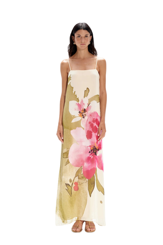 White maxi dress with green and pink tropical floral print and spaghetti straps by Especia worn with sandals