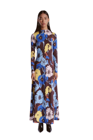De Loreta Mandy Dress featuring a colorful oversized floral print, long sleeves, high neckline, and maxi silhouette.