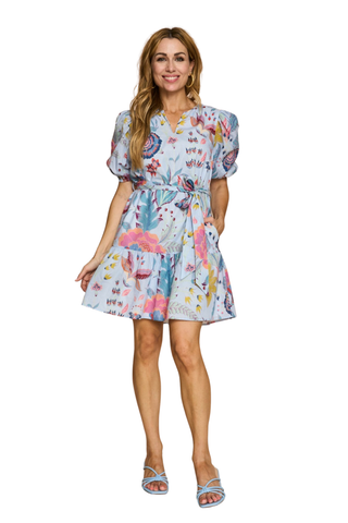 Blue floral mini dress with puff sleeves, tiered skirt, and tie waist