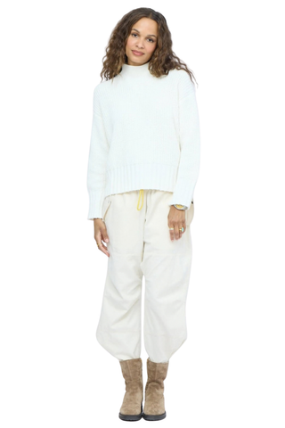 Kerri Rosenthal Marlow Imperfect Heart Sweater in Natural featuring a soft ivory rib knit, mock neck, and contrast heart elbow patches.