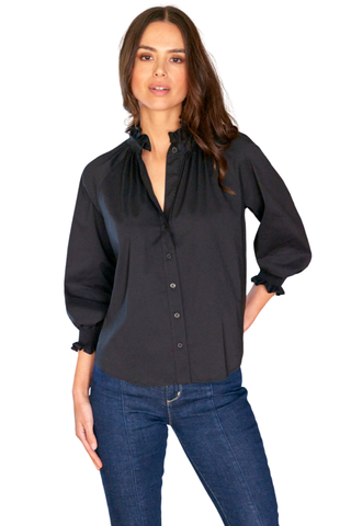 Finley Fiona Shirt in Black featuring a high ruffled neckline, button-front closure, three-quarter-length blouson sleeves with smocked cuffs, and relaxed poplin silhouette.