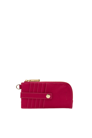 Pink wallet with gold accents on a white background