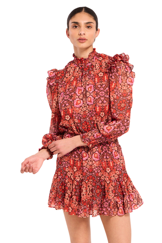 Misa Gianna Dress in Boheme Mix featuring a vibrant red and pink bohemian print, high smocked neckline, long blouson sleeves, and tiered ruffle mini skirt.