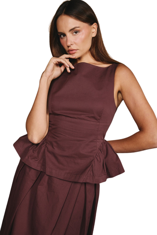 Love the Label Earnshaw Top in Deep Mahogany featuring a sleeveless fitted bodice with a softly flared peplum-style hem.