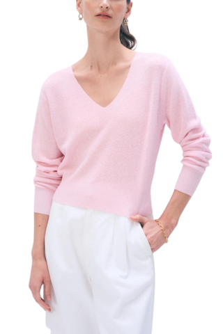 Light pink long sleeve V-neck sweater in a soft knit fabric