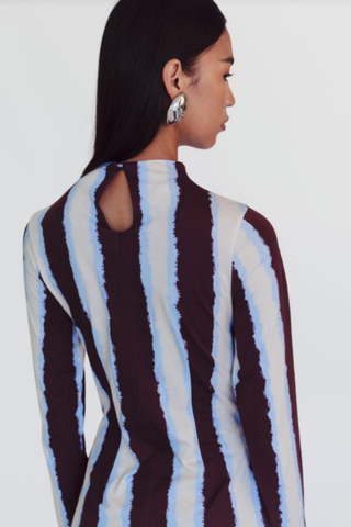 De Loreta Kira Dress in Campo featuring a striped print, long sleeves, high neckline, and mini silhouette.