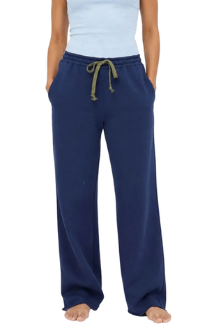 Kerri Rosenthal Weekend Barb Sweatpant in indigo blue featuring a wide-leg silhouette, elastic waistband, and embroidered heart detail.