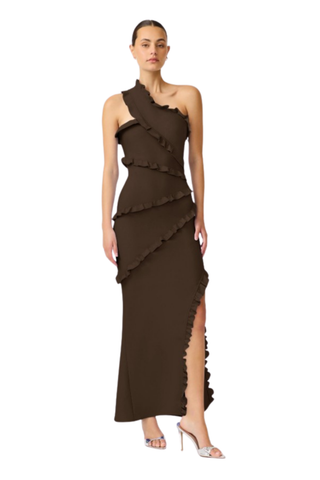 Elliatt Floriana Asymmetric Neck Gown in Brown with one-shoulder neckline, cascading ruffle detailing, floor-length skirt, and thigh-high side slit.