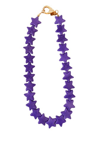 Smith & Co. Design Large Star Necklace in Purple featuring oversized vibrant purple star-shaped beads and a lobster clasp closure.