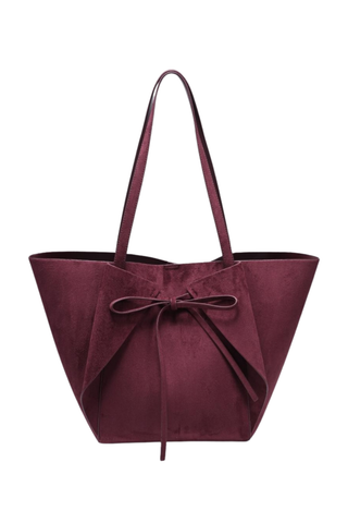 Urban Expressions Soren Tote in Burgundy vegan suede with long shoulder straps, bow-front detail, and matching zip pouch.