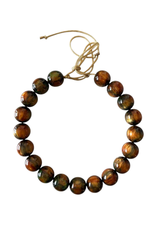 KMS Gems Chunky Beaded Necklace in Amber Glow featuring oversized marbled amber, brown, and earthy-toned beads with an adjustable silk cord.