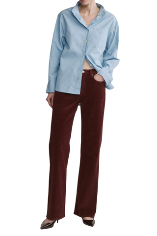 DL1961 Bella Slim Boot Jean in Syrah Cord featuring a mid-rise slim bootcut silhouette in muted red corduroy.