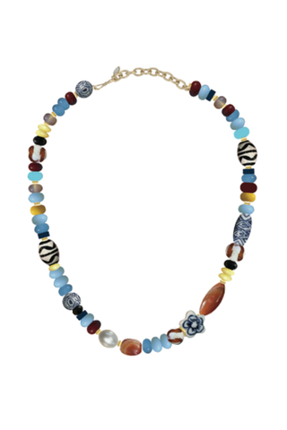 Mignonne Gavigan Ribeira Necklace featuring an eclectic strand of multicolored beads in blue, red, cream, brown, and gold tones.