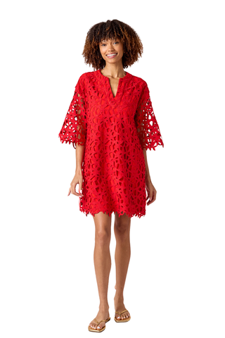 Model wearing Crosby Alice Tunic Dress in Pomegranate Lace, a red lace tunic mini dress with elbow-length sleeves and scalloped detailing
