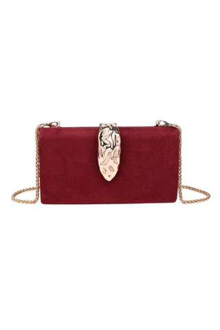 Urban Expressions Babe Clutch in Burgundy featuring a rich suede-effect exterior, sculptural hammered metal clasp, and removable chain strap.