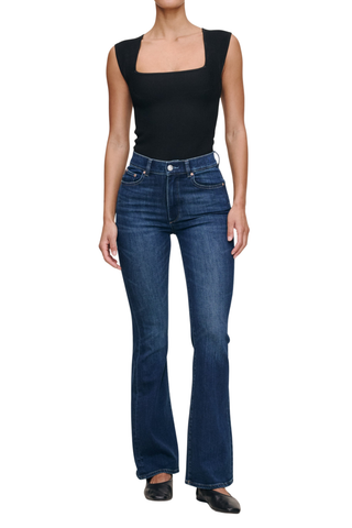Model wearing the DL1961 Bridget Boot Jean in Sea Front with a high-rise bootcut silhouette.