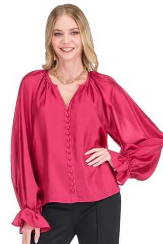 Jade Trimmed Peasant Top in Berry featuring a bright berry pink hue, V-neckline, decorative trim, and billowy long sleeves.