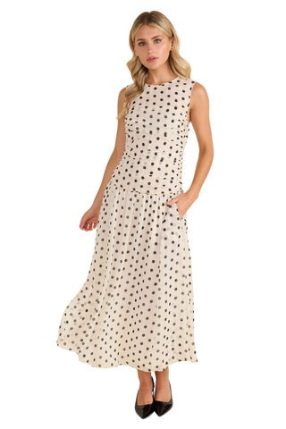Thomas & Lourdes Agatha Dress in Parisian Dot featuring a cream and black dot print, sleeveless bodice, and flowing midi skirt.