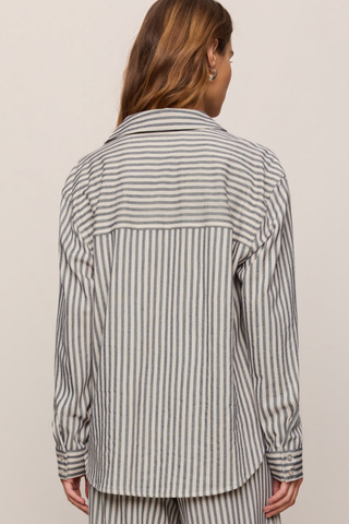 Model wearing the Z Supply Reese Button Up Stripe Top in Eclipse featuring striped knit fabric, long sleeves, and a relaxed fit.