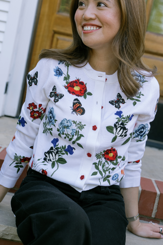 Alice + Olivia Ruthy Embellished Cardigan in Off White Multi featuring colorful floral embellishments, long sleeves, and a cropped button-front silhouette.