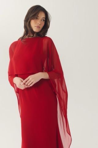 Elegant red gown with flowing chiffon cape sleeves.