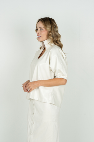 Emily McCarthy Poppy Top in Carrara white featuring a collared V-neckline, short gathered puff sleeves, and relaxed silhouette.