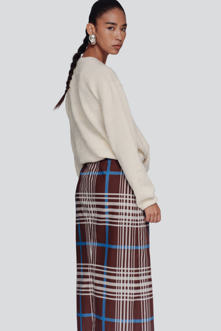 De Loreta Magangue Skirt in Horizonte featuring a multicolor plaid pattern and midi-length silhouette.