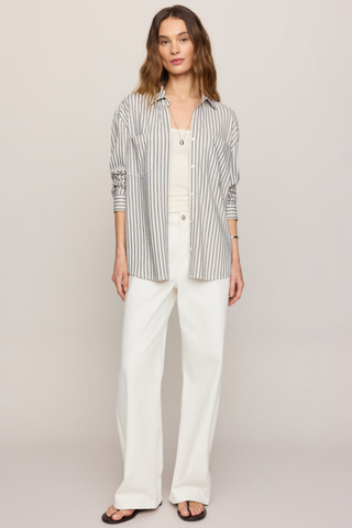 Model wearing the Z Supply Reese Button Up Stripe Top in Eclipse featuring striped knit fabric, long sleeves, and a relaxed fit.