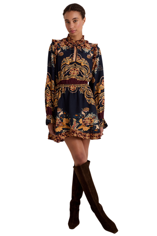 Thalia Dress in Lasso featuring a navy Western-inspired print, long sleeves, ruffle detailing, and a handkerchief mini hem.