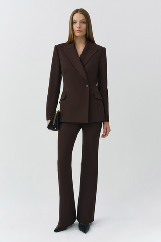 SIMKHAI Kenna Trouser in chocolate brown featuring a high-rise waist, tailored fit, and subtly flared leg.