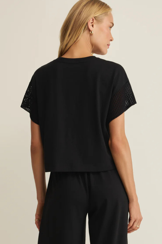 Z Supply Banyan Crochet Top in Black featuring crochet-inspired short sleeves, relaxed fit, crew neckline, and soft lightweight jersey fabric