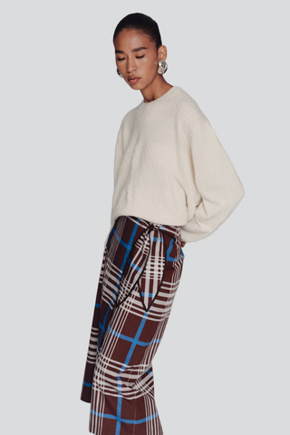 De Loreta Magangue Skirt in Horizonte featuring a multicolor plaid pattern and midi-length silhouette.