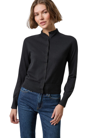 A woman modeling a black long-sleeve button-front cardigan with a stand collar, paired with blue jeans, against a plain white background.
