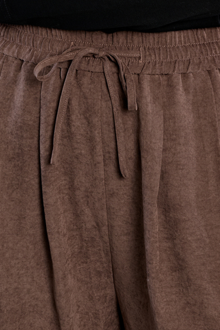 Molly Bracken Woven Pants in chocolate brown with a gathered waist, front pleats, and relaxed wide-leg silhouette.