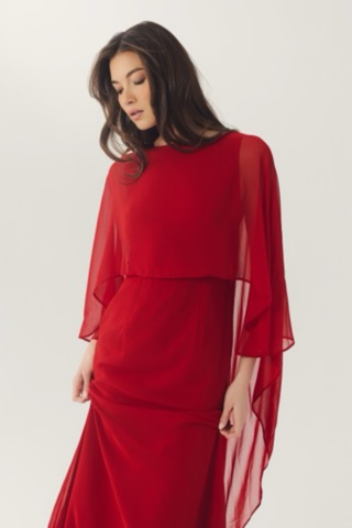 Elegant red gown with flowing chiffon cape sleeves.