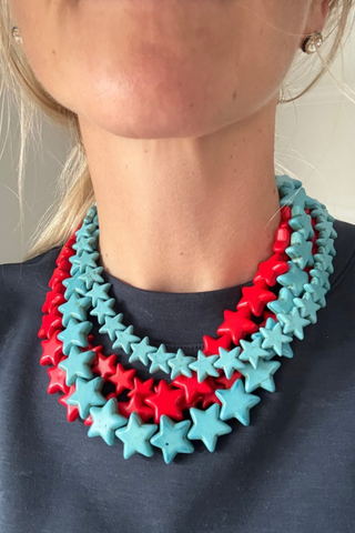 Smith & Co. Design Large Star Necklace in Turquoise featuring oversized vibrant turquoise star-shaped beads and a gold-plated lobster clasp.