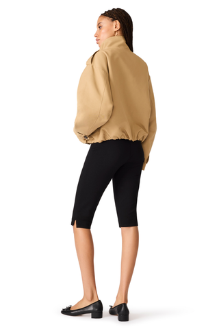 Medium khaki utility jacket with a stand collar and oversized silhouette.