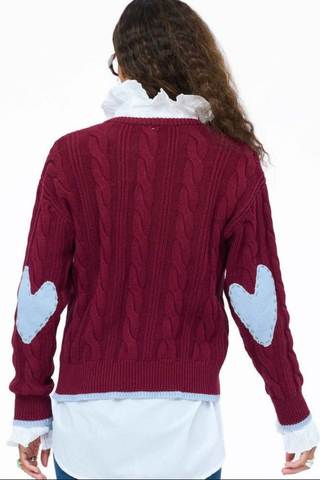 Kerri Rosenthal Maxwork Cable Pullover Sweater in burgundy featuring cable knit texture, contrast tipping, and heart elbow patches.