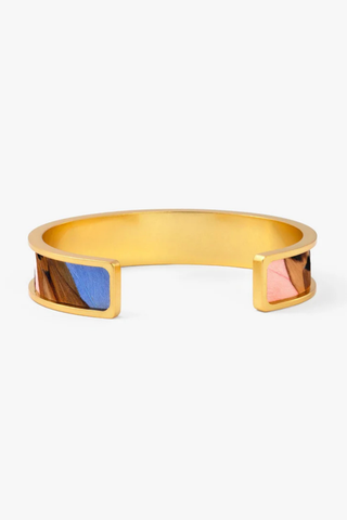 Brackish Shannon Thin Cuff bracelet with handcrafted feather detailing, gold peacock accents, and 24k gold plated finish
