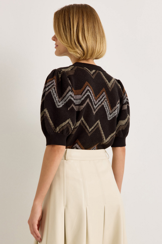 Marie Oliver Maddie Top in Electric featuring a multicolored neutral zigzag knit pattern, short puff sleeves, and ribbed crew neckline.